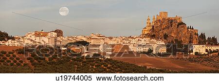 Stock Photography - Spain, Andalusia, Olvera, Panoramic view of townscape with moonrise. Fotosearch