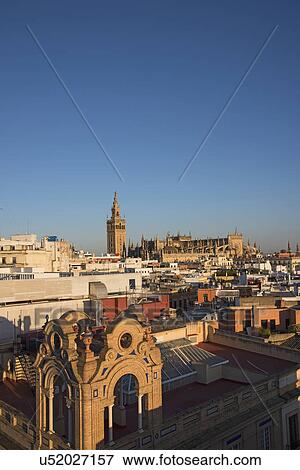 Stock Photo - Spain, Andalusia, Seville, Cityscape with Seville Cathedral and La Giralda. Fotosearch