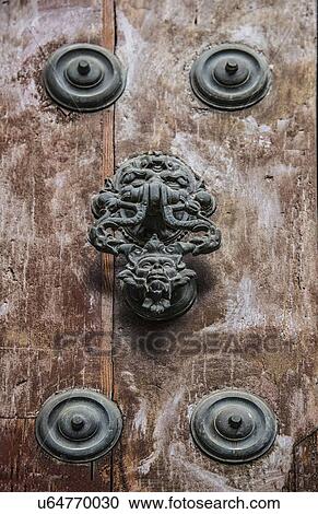 Stock Image - Spain, Andalusia, Seville, Decorative door knocker. Fotosearch