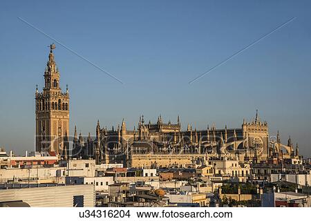 Picture - Spain, Andalusia, Seville, La Giralda, Cityscape with Seville Cathedral. Fotosearch