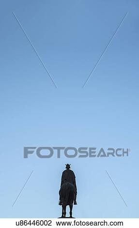 Stock Image - Spain, Andalusia, Seville, Plaza Nueva, Equestrian monument of king Ferdinand III. Fotosearch