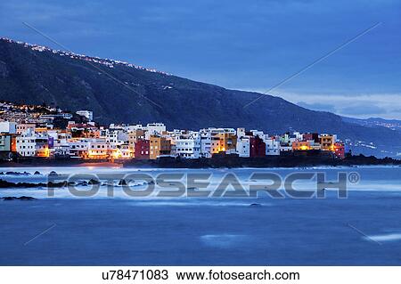 Stock Image - Spain, Canary Islands, Tenerife, Puerto de la Cruz, Puerto de la Cruz at night. Fotosearch