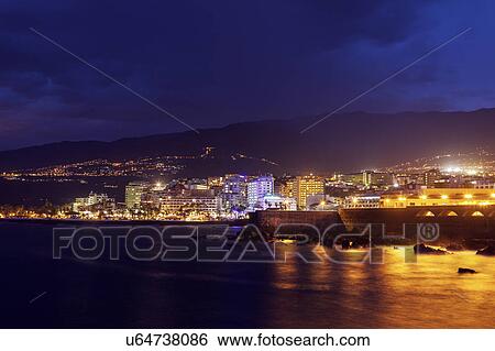 Spain, Canary Islands, Tenerife, Puerto de la Cruz, Puerto de la Cruz at night View Large Photo Image Stock Photograph - Spain, Canary Islands, Tenerife, Puerto de la Cruz, Puerto de la Cruz at night. Fotosearch