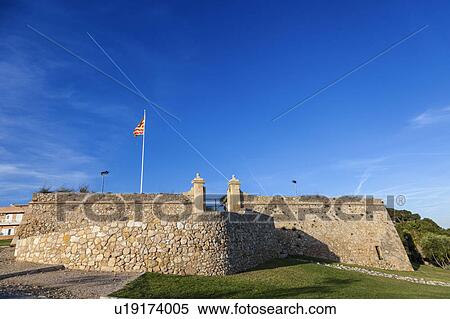 Spain, Catalonia, Tarragona, Fort of Sant Jordi with blue sky above View Large Photo Image Stock Photography - Spain, Catalonia, Tarragona, Fort of Sant Jordi with blue sky above. Fotosearch