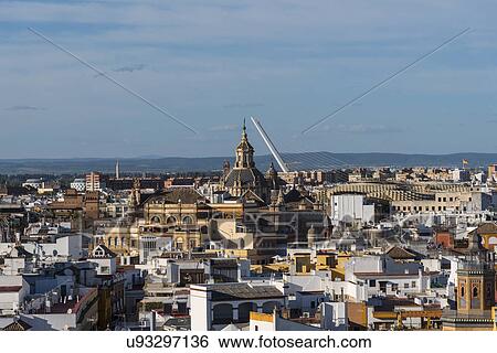 Stock Photograph - Spain, Seville, Cityscape in sunlight. Fotosearch