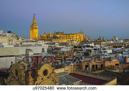 Spain, Seville, Cityscape with Cathedral of Seville at sunset View Large Photo Image Stock Image - Spain, Seville, Cityscape with Cathedral of Seville at sunset. Fotosearch
