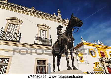 Stock Image - Spain, Seville, Equestrian statue of Augusta Senora Condesa de Barcelona in front of Plaza de Toros. Fotosearch