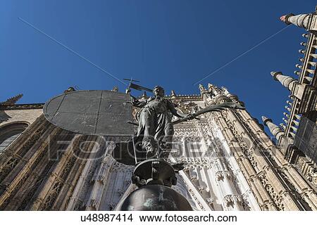 Spain, Seville, Facade of Cathedral of Seville with statue View Large Photo Image Picture - Spain, Seville, Facade of Cathedral of Seville with statue. Fotosearch