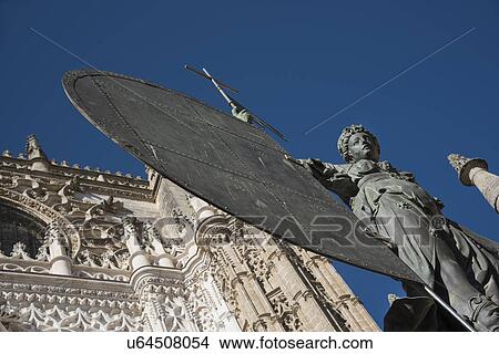 Spain, Seville, Facade of Cathedral of Seville with statue View Large Photo Image Picture - Spain, Seville, Facade of Cathedral of Seville with statue. Fotosearch