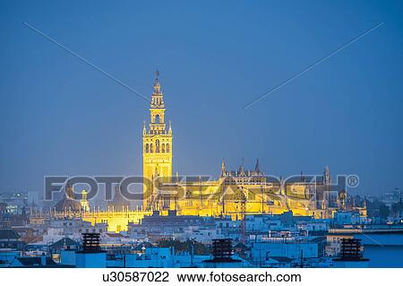 Spain, Seville, Giralda and Cathedral of Seville at dusk View Large Photo Image Stock Image - Spain, Seville, Giralda and Cathedral of Seville at dusk. Fotosearch