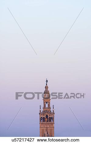 Stock Photo - Spain, Seville, Giralda tower at dawn. Fotosearch