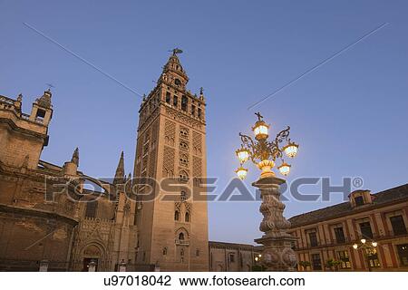 Spain, Seville, Giralda Tower at dusk View Large Photo Image Stock Image - Spain, Seville, Giralda Tower at dusk. Fotosearch