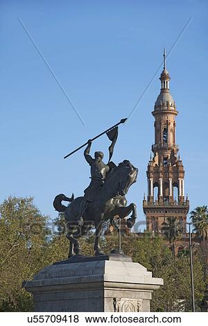 Stock Photo - Spain, Seville, Plaza De Espana, Equestrian statue and tower. Fotosearch