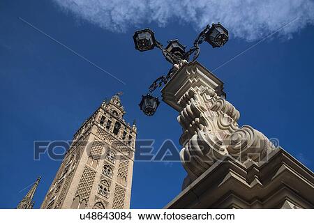 Spain, Seville, Plaza Virgin De Los Reyes, Tower of Giralda View Large Photo Image Picture - Spain, Seville, Plaza Virgin De Los Reyes, Tower of Giralda. Fotosearch