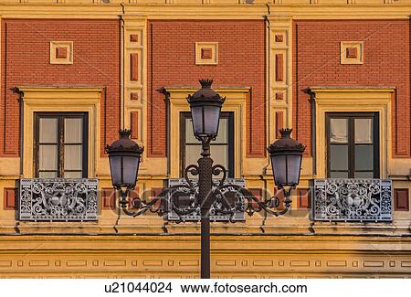 Picture - Spain, Seville, Streetlight and facade of Palacio de San Telmo. Fotosearch