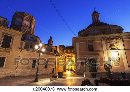 Stock Image - Spain, Valencia, Cathedral de Valencia and Basilica of our Lady of Forsaken at dusk. Fotosearch