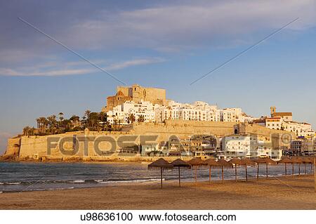 Stock Image - Spain, Valencian Community, Peniscola, Waterfront town on hill with sea and beach in foreground. Fotosearch