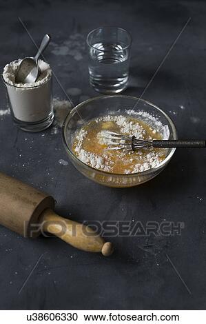 Stock Image - Still life with eggs, flour and water. Fotosearch