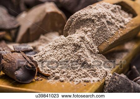 Still life with wooden scoop full with chocolate powder View Large Photo Image Stock Image - Still life with wooden scoop full with chocolate powder. Fotosearch