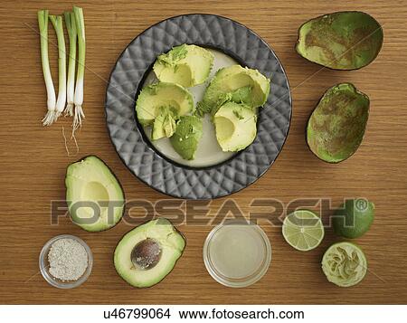 Picture - Studio shot of avocado, lime and scallion for guacamole. Fotosearch
