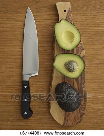Studio shot of avocado on cutting board for guacamole View Large Photo Image Stock Photo - Studio shot of avocado on cutting board for guacamole. Fotosearch