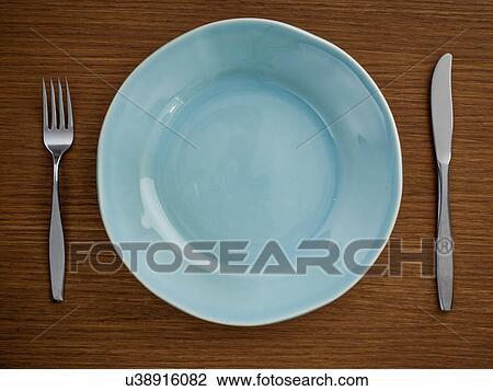 Studio shot of blue plate with fork and knife View Large Photo Image Stock Image - Studio shot of blue plate with fork and knife. Fotosearch