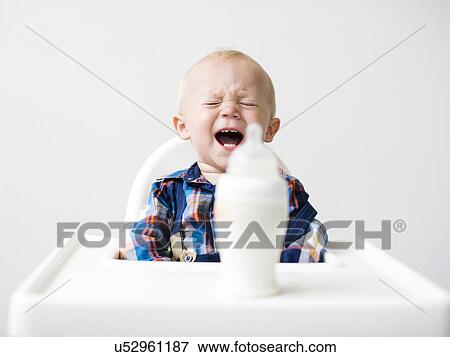 Studio shot of boy (12-17 months) crying View Large Photo Image Stock Photo - Studio shot of boy (12-17 months) crying. Fotosearch