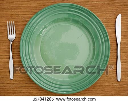 Studio shot of green plate with fork and knife View Large Photo Image Stock Photography - Studio shot of green plate with fork and knife. Fotosearch