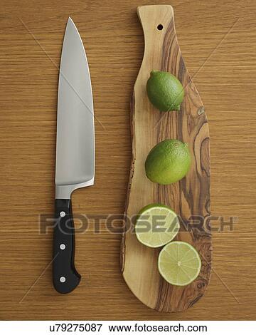 Studio shot of lime on cutting board for guacamole View Large Photo Image Stock Photo - Studio shot of lime on cutting board for guacamole. Fotosearch