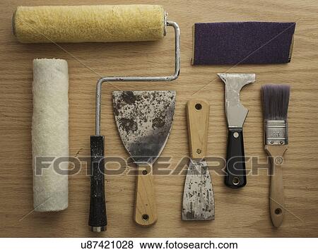 Stock Photo - Studio shot of painting tools on wooden table. Fotosearch