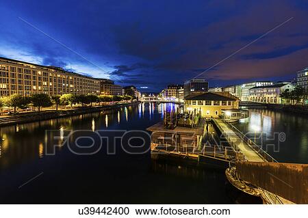 Stock Image - Switzerland, Geneva, Architecture of Geneva along Rhone River. Fotosearch