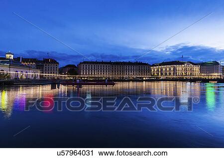 Stock Image - Switzerland, Geneva, Architecture of Geneva along Rhone River. Fotosearch