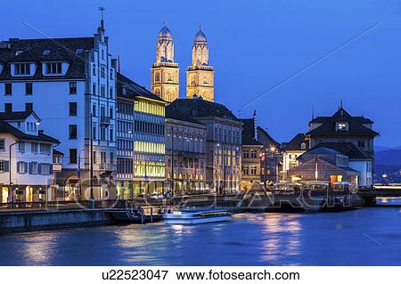 Switzerland, Zurich, Grossmunster Church and Limmat River, City scene at promenade at night View Large Photo Image Stock Photo - Switzerland, Zurich, Grossmunster Church and Limmat River, City scene at promenade at night. Fotosearch