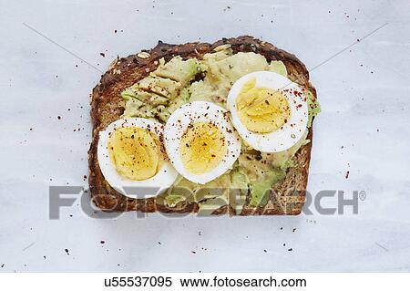 Toasted bread with avocado and hard boiled egg View Large Photo Image Stock Photography - Toasted bread with avocado and hard boiled egg. Fotosearch