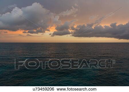 Stock Photograph - Tranquil seascape in sunset. Fotosearch