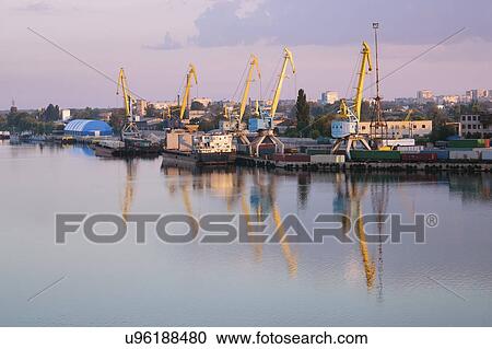Stock Image - Ukraine, Dnepropetrovsk, Commercial dock at sunset. Fotosearch