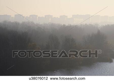 Ukraine, Dnepropetrovsk, Forest and remote city skyline at foggy dawn View Large Photo Image Stock Image - Ukraine, Dnepropetrovsk, Forest and remote city skyline at foggy dawn. Fotosearch