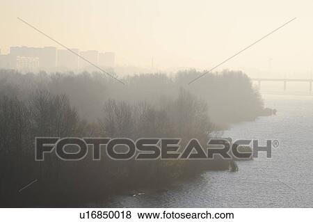 Ukraine, Dnepropetrovsk, Forest and river at foggy dawn View Large Photo Image Stock Photo - Ukraine, Dnepropetrovsk, Forest and river at foggy dawn. Fotosearch