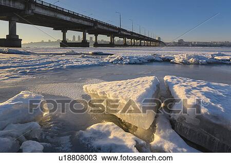 Ukraine, Dnepropetrovsk region, Dnepropetrovsk city, Bridge over frozen river View Large Photo Image Stock Image - Ukraine, Dnepropetrovsk region, Dnepropetrovsk city, Bridge over frozen river. Fotosearch