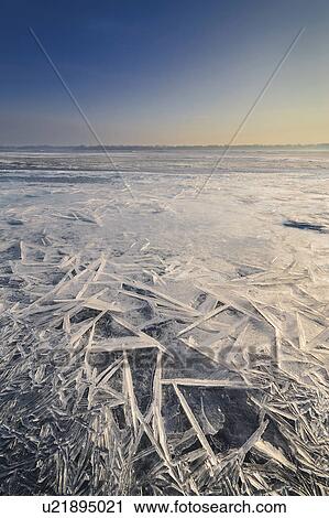 Stock Image - Ukraine, Dnepropetrovsk region, Dnepropetrovsk city, Ice patterns on frozen river. Fotosearch
