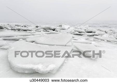 Stock Image - Ukraine, Dnepropetrovsk region, Dnepropetrovsk city, Frozen river with lumps of ice. Fotosearch