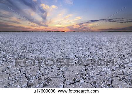 Stock Photo - Ukraine, Dnepropetrovsk Region, Novomoskovskiy District, Lake Soleniy Lyman, Desert at sunset. Fotosearch