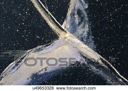 Stock Photo - Ukraine, Dnepropetrovsk region, Dnepropetrovsk city, Cracks in ice. Fotosearch