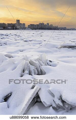Ukraine, Dnepropetrovsk region, Dnepropetrovsk city, Frozen river with distant cityscape View Large Photo Image Stock Photo - Ukraine, Dnepropetrovsk region, Dnepropetrovsk city, Frozen river with distant cityscape. Fotosearch