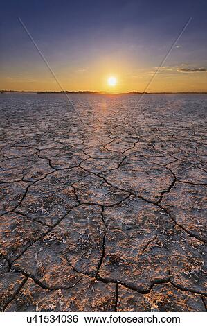 Stock Photograph - Ukraine, Dnepropetrovsk Region, Novomoskovskiy District, Lake Soleniy Lyman, Desert at sunset. Fotosearch