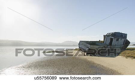 USA, California, Inverness, Point Reyes, Tomales Bay, Shipwreck on sandy coast View Large Photo Image Stock Photo - USA, California, Inverness, Point Reyes, Tomales Bay, Shipwreck on sandy coast. Fotosearch