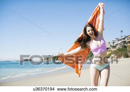 Picture - USA, California, Woman laughing on Laguna Beach. Fotosearch