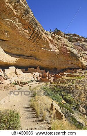 Stock Photograph - USA, Colorado, Long House pueblo ruin under cliff in Mesa Verde National Park. Fotosearch
