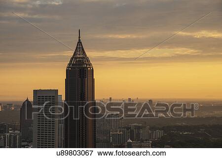 Stock Photo - USA, Georgia, Atlanta, Cityscape with skyscrapers at sunrise. Fotosearch