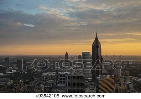 Stock Photograph - USA, Georgia, Atlanta, Cityscape with skyscrapers at sunrise. Fotosearch